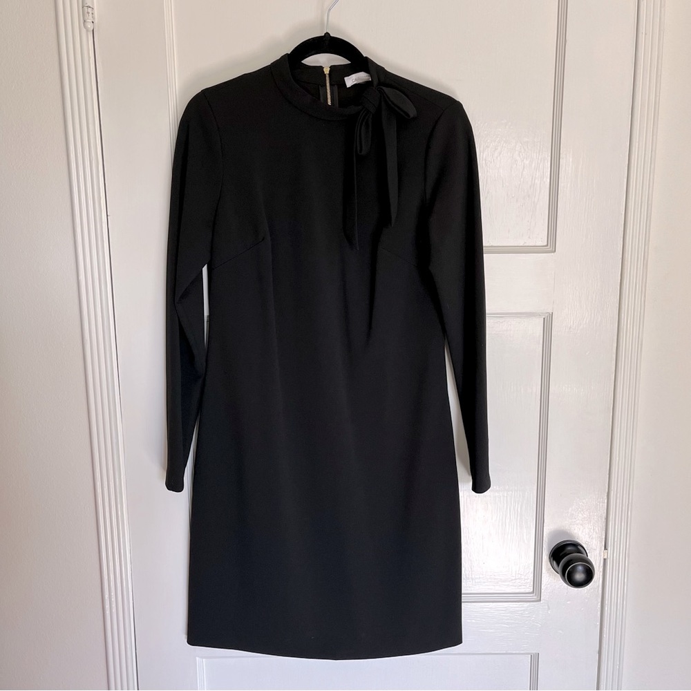 Calvin Klein long sleeve dress with bow detail. Never worn! Size 8.